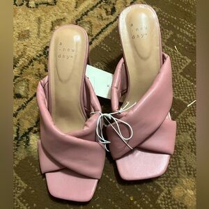 Gorgeous orchid color cross strap heels.